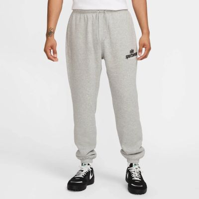 M NK CLUB BB CF PANT NSW GFX in 063 dk grey heather/lt smoke g